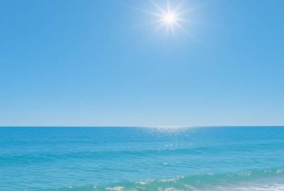 relaxing trtp wellbeing, rejuvenating, practicing yoga, photorealistic, a serene beach at dawn, highly detailed, crashing waves, panoramic view, warm hues, sunrise lighting, shot with an ultra-wide angle lens.